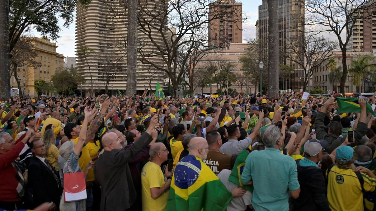 Supporters watch as Brazil's president and candidate for re-election Jair Bolsonaro attends a campaign rally in Belo Horizonte, Brazil. Credit: Reuters photo
