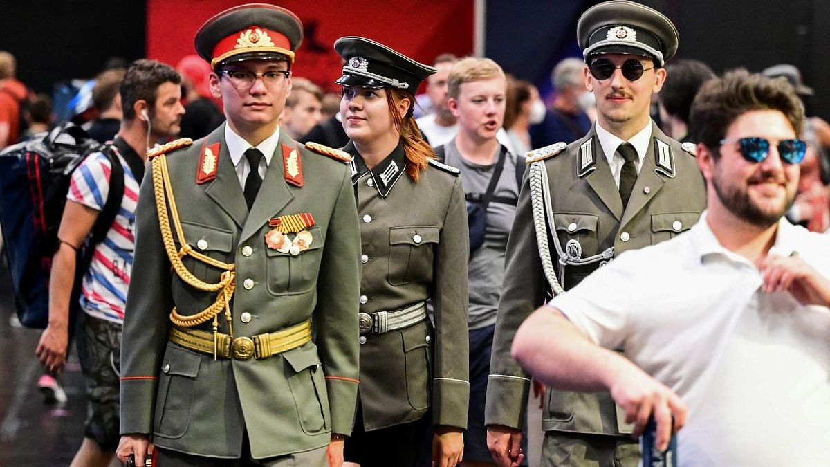 People wearing NVA-uniforms of the former German Democratic Republic attend the Gamescom 2022 in Cologne, Germany. Credit: Reuters Photo