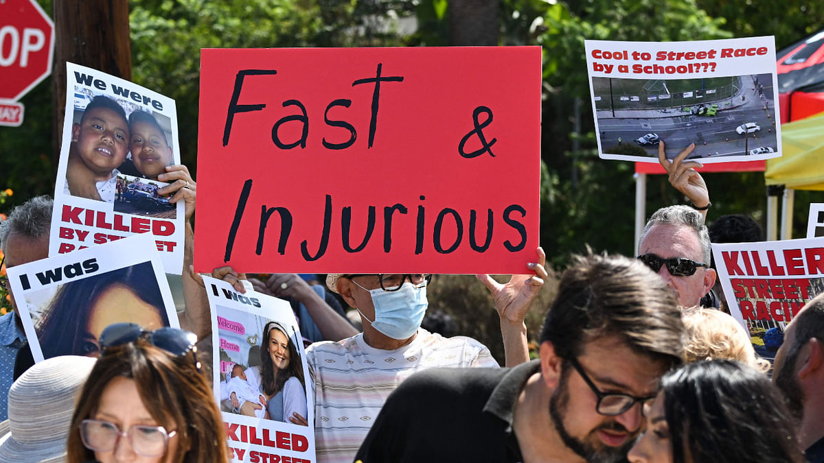 Local residents and supporters of the group Street Racing Kills protest the increase in street racing takeovers and the latest Fast and Furious movie being filmed in the Angelino Heights neighborhood of Los Angeles, California on August 26, 2022. Credit: AFP Photo