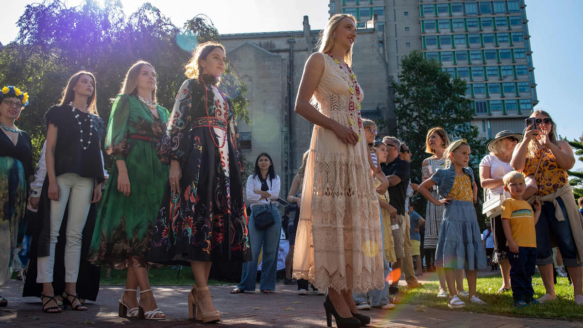 Models wearing Ukrainian designed outfits prepare to walk the runway during the Ukrainian Festival and Independence Day in Boston, Massachusetts, on August 27, 2022. Credit: AFP Photo