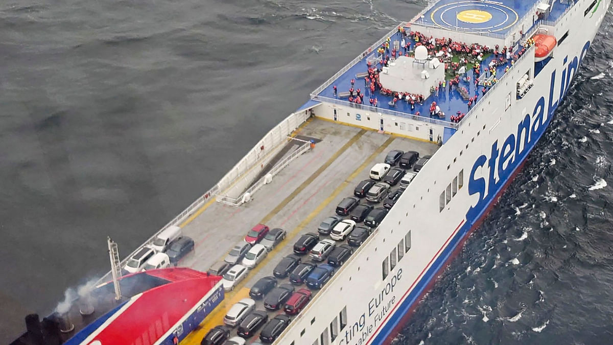 This handout photo taken and released by Sweden's Maritime Administration (Sjöfartsverket) on August 29, 2022 shows an aerial view of cars and passengers on deck of the ship Stena Scandica off the Swedish island of Gotska Sandön, after a fire broke out on the ferry. Credit: AFP Photo / John Jonsson / Sweden's Maritime Administration