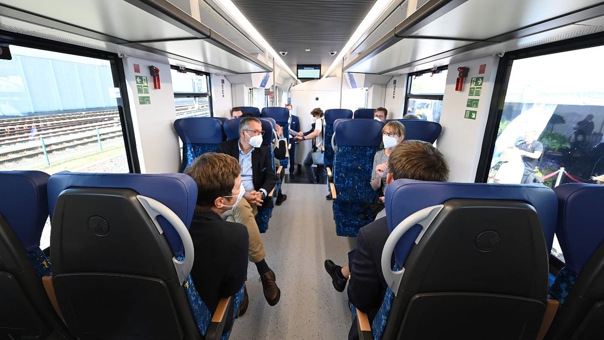 People sit inside a train powered entirely by hydrogen in Bremervoerde, Germany. Credit: AFP Photo