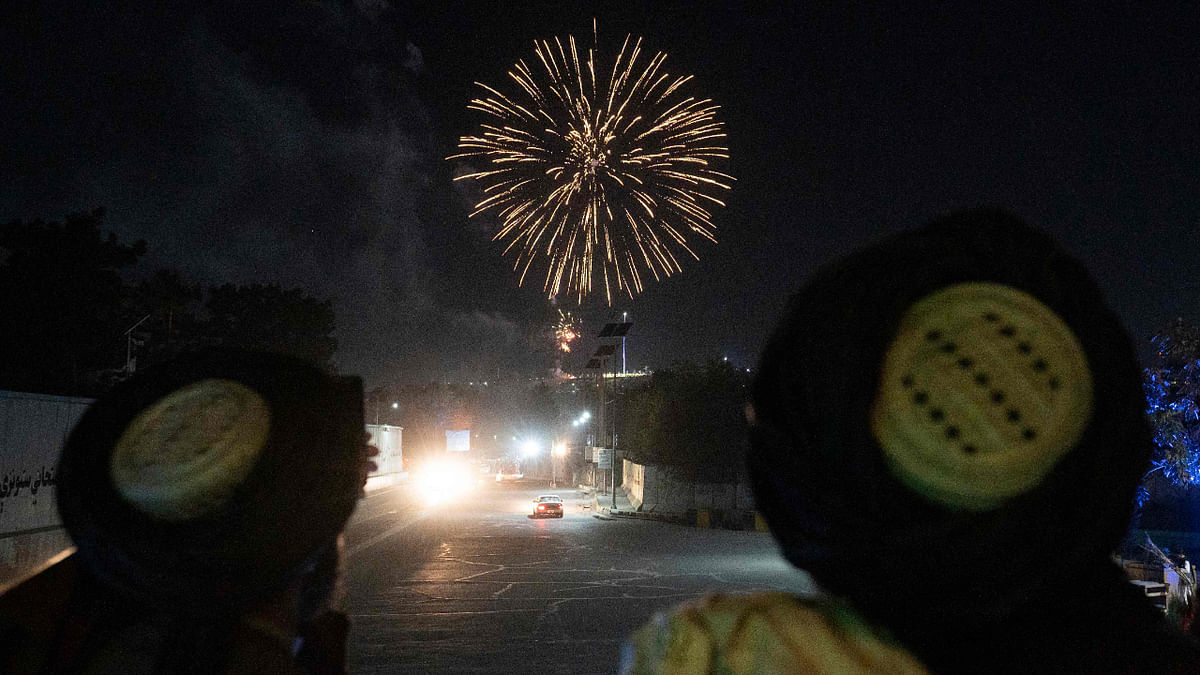 Taliban fighters set off fireworks in the skies of Kabul as they celebrate the first anniversary of US troops withdrawal from Afghanistan, near the former US embassy in Kabul on August 30, 2022. Credit: AFP Photo
