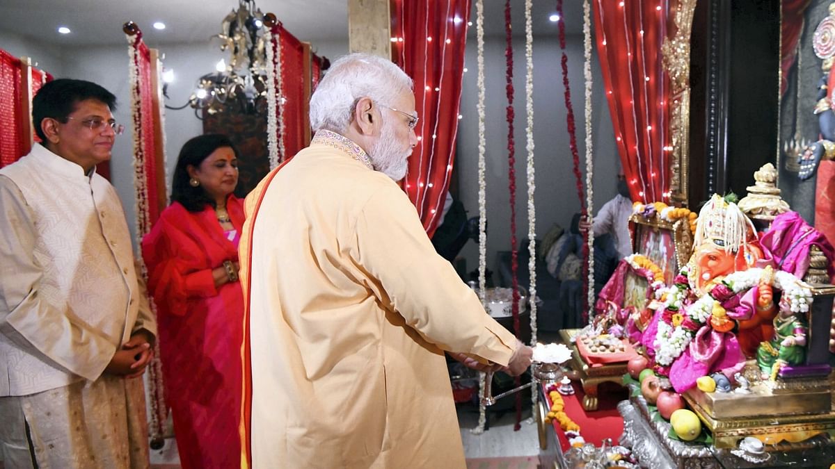 Prime Minister Narendra Modi visited the residence of Union Minister Piyush Goyal in New Delhi and performed 'aarti' on the occasion of Ganesh Chaturthi. Credit: PTI Photo