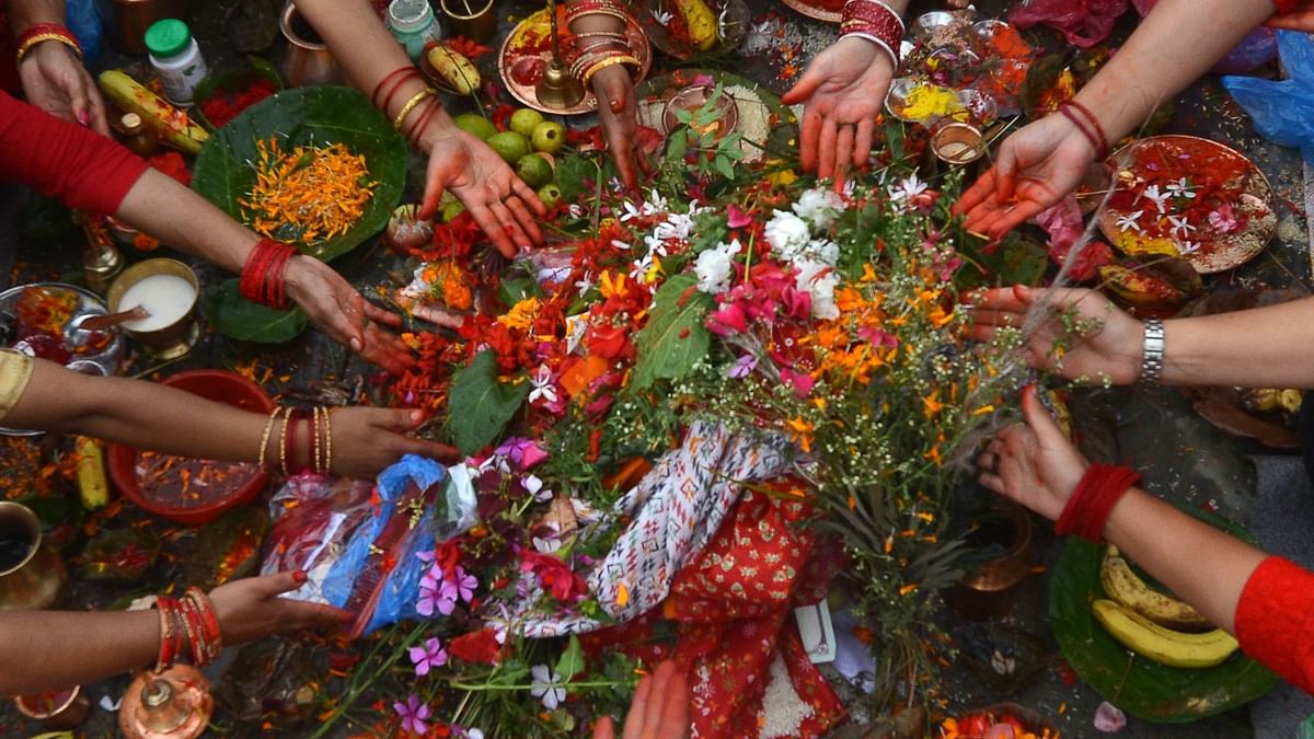 Hindu devotees offer prayers on the banks of the Bagmati River on the occasion of Rishi Panchami at the end of the three-day long Teej Festival, in which Hindu women fast during the day and pray for the long lives for their husbands, in Kathmandu. Credit: AFP Photo
