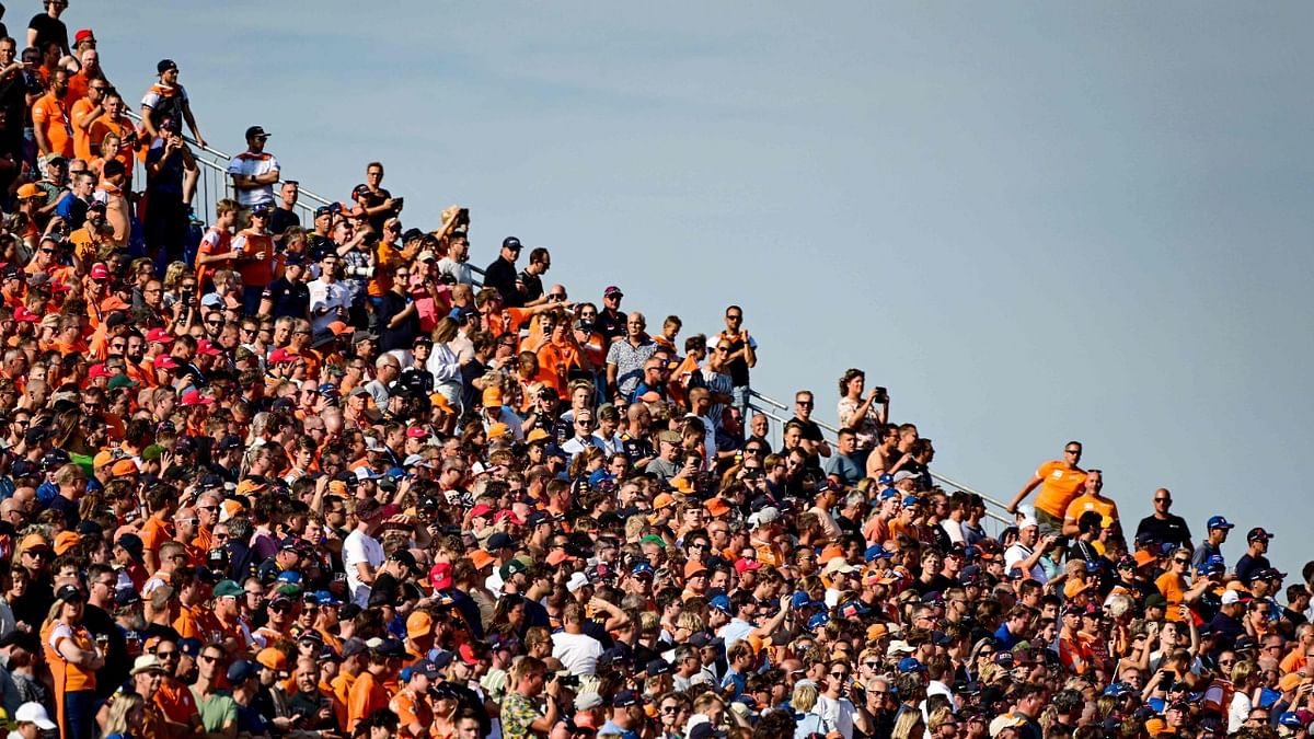 Spectators watch the second free practice session ahead of the Dutch Formula One Grand Prix at the Zandvoort circuit. Credit: AFP Photo