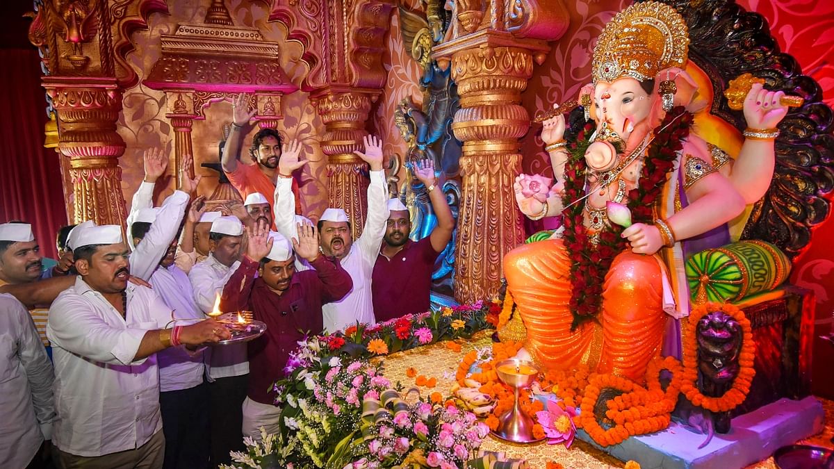 Devotees worship Lord Ganesh on Ganesh Chaturthi in Patna. Credit: PTI Photo