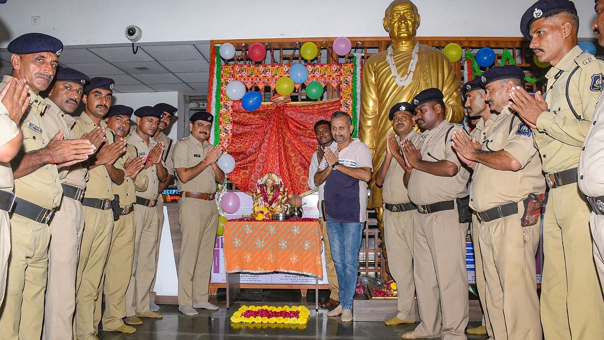 Gujarat police offer prayers to Lord Ganesha on Ganesh Chaturthi at a police station in Surat. Credit: PTI Photo
