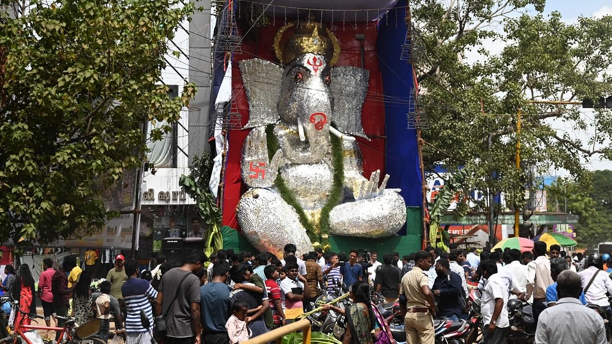 Devotees gather to see a 30-feet tall idol of lord Ganesha made of metal skewers during Ganesh Chaturthi in Chennai. Credit: AFP Photo