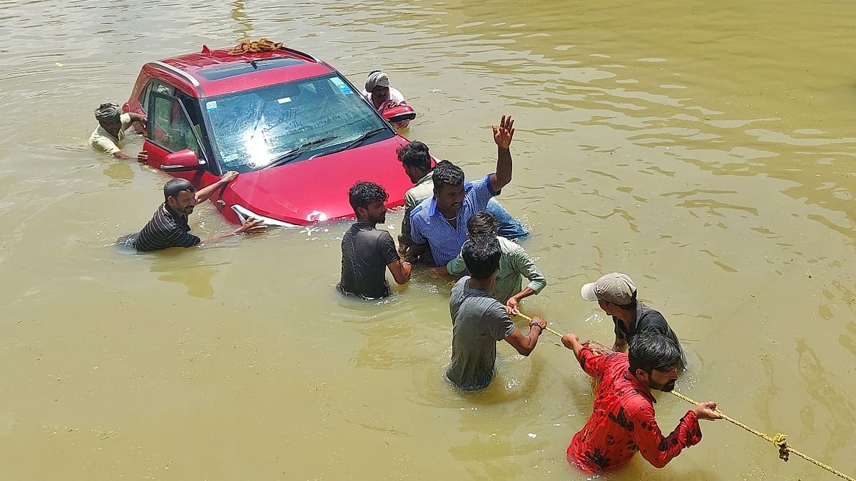 Many vehicles remain stranded due to waterlogging and people faced many hurdles to commute to places. Credit: Reuters Photo