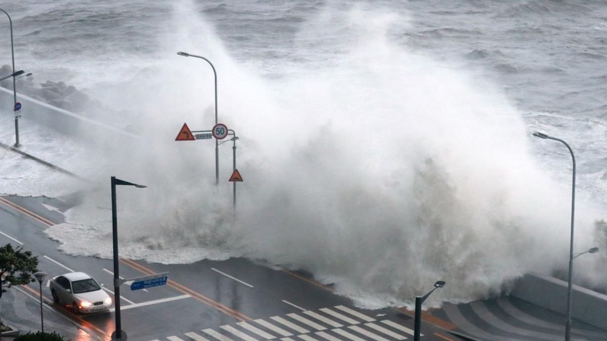 Waves crash along a sea wall in Busan on September 6, 2022, as Typhoon Hinnamnor hit South Korea's southern provinces. Credit: AFP Photo