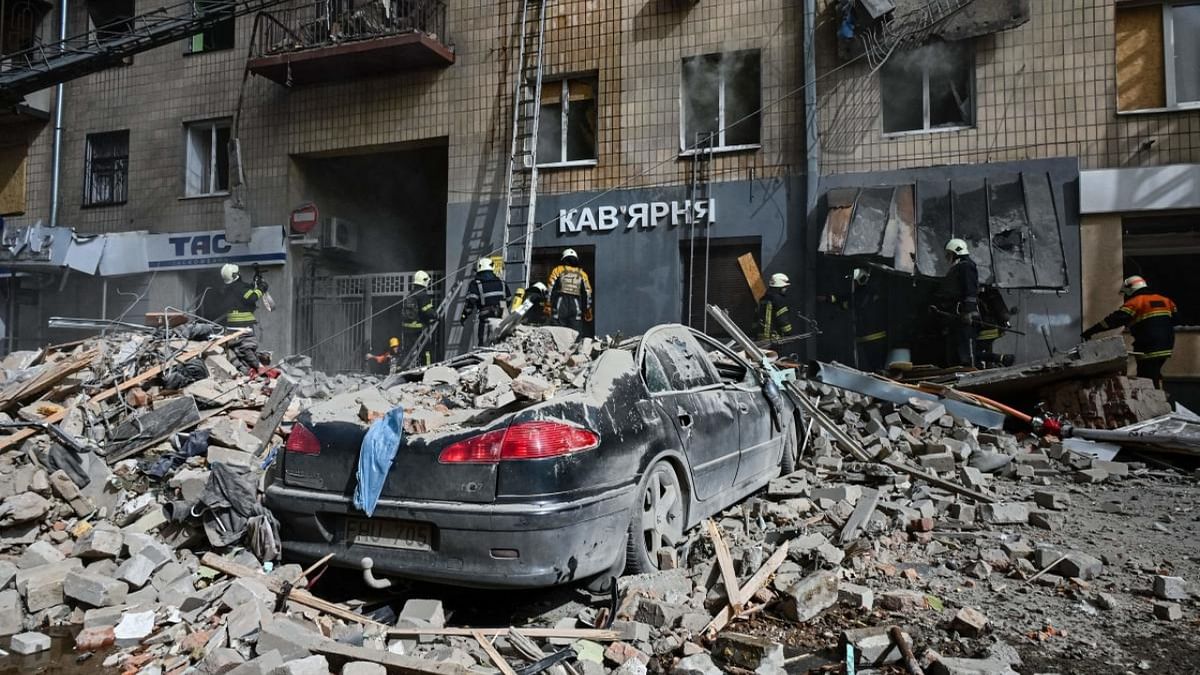 Firefighters search in the rubble after an apartment was hit by a missile strike in Kharkiv, on September 6, 2022, amid the Russian invasion of Ukraine.  Credit: AFP Photo