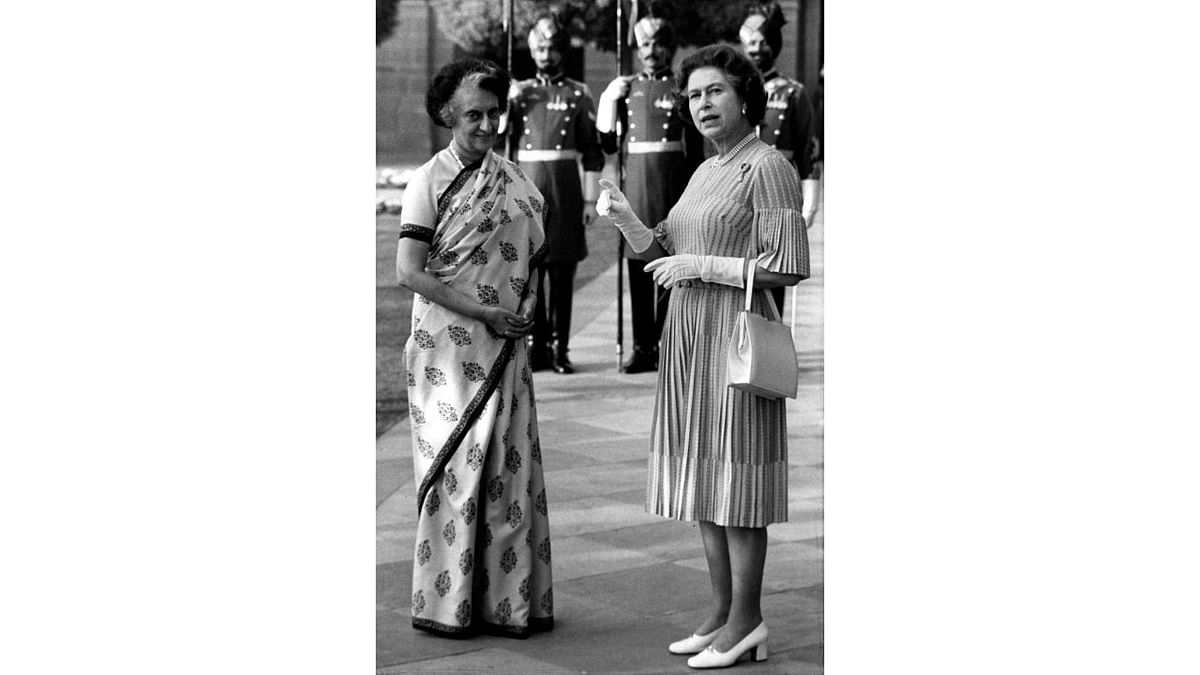 Queen Elizabeth II gestures as she speaks to Prime Minister Indira Gandhi at the Rashtrapati Bhavan on her visit to India in 1983. Credit: AP Photo