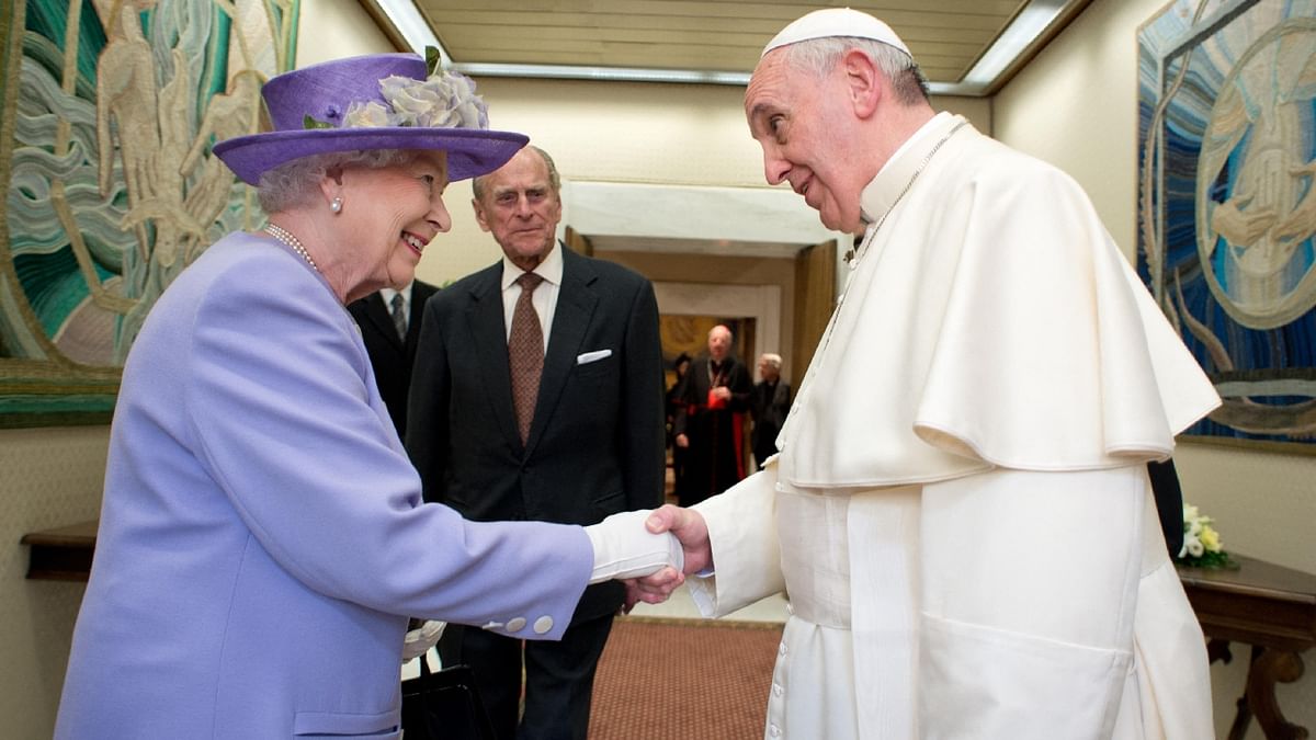 Queen Elizabeth II greets Pope Francis at the Vatican during her visit in April 2014. Credit: AFP Photo