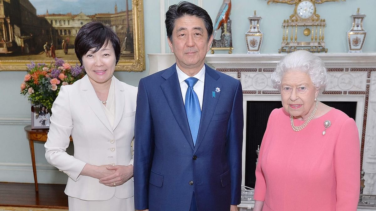 A picture of Queen Elizabeth II with Japanese Prime Minister Shinzo Abe and his wife, Akie, at Buckingham Palace in central London, 2016. Credit: AFP Photo