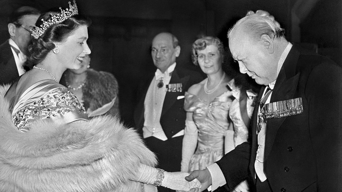 Elizabeth greets former Prime Minister of the United Kingdom Winston Churchill at a Guildhall reception, in London in 1950. Credit: AFP Photo