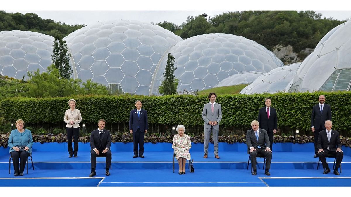 Queen Elizabeth II poses for a photo with Germany's Chancellor Angela Merkel, President of the European Commission Ursula von der Leyen, France's President Emmanuel Macron, Japan's Prime Minister Yoshihide Suga, Canada's Prime Minister Justin Trudeau, Britain's Prime Minister Boris Johnson, Italy's Prime minister Mario Draghi, President of the European Council Charles Michel and US President Joe Biden, during an evening reception at The Eden Project in England in June 2021. Credit: AFP Photo