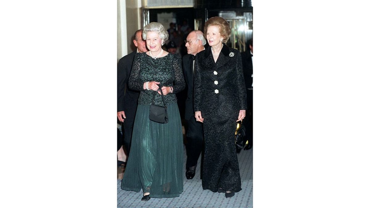 Queen Elizabeth II with former British Prime Minister Thatcher during a dinner to celebrate the latter's 70th birthday. Credit: AFP Photo