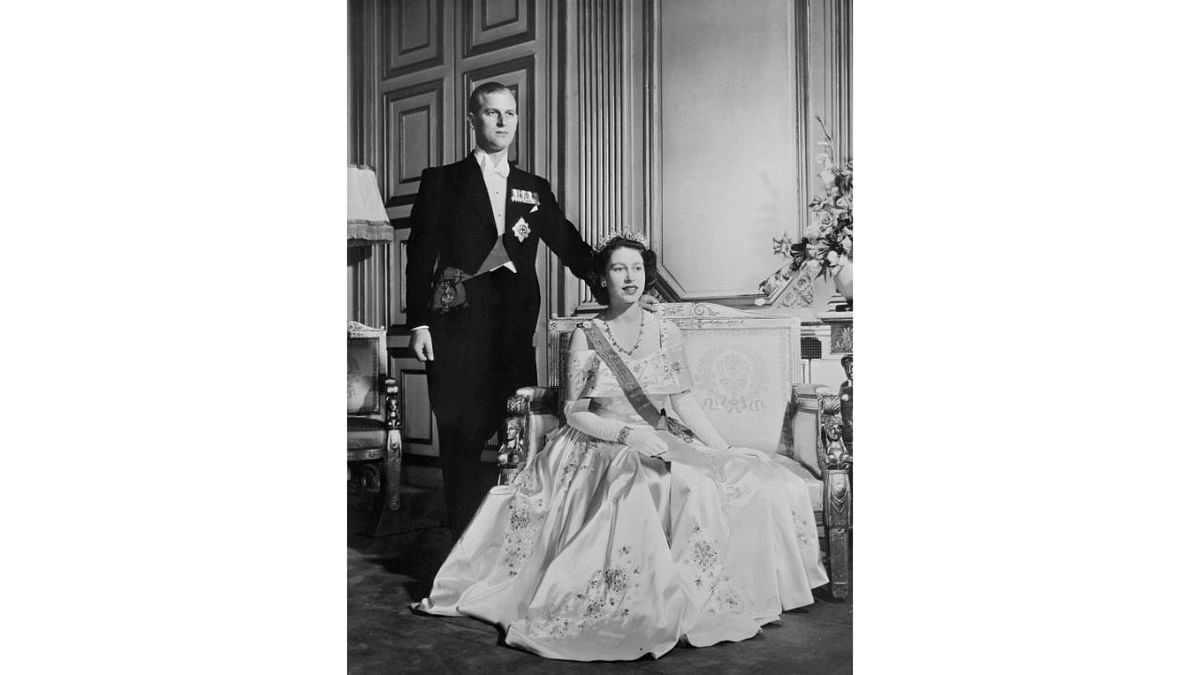 Queen Elizabeth and Prince Philip The Duke of Edinburgh pose in Buckingham Palace, in London in 1948. Credit: AFP Photo