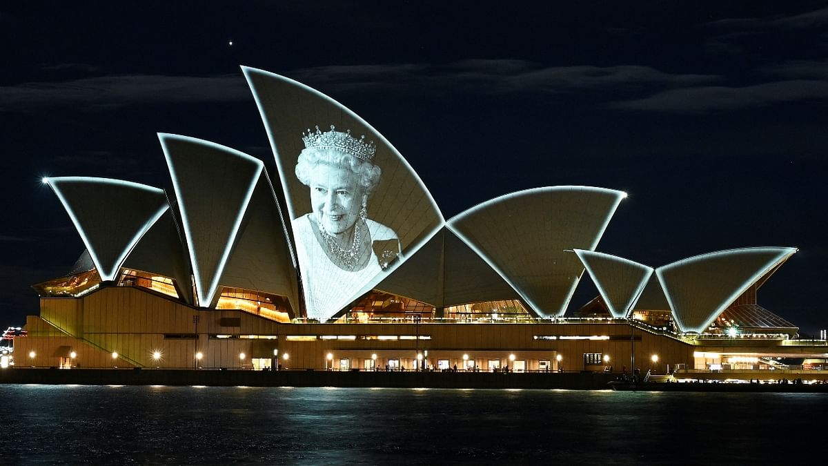 An image of Britain's Queen Elizabeth II is illuminated on the sail of Sydney Opera House, following the Queen's passing, in Sydney, Australia. Credit: Reuters Photo