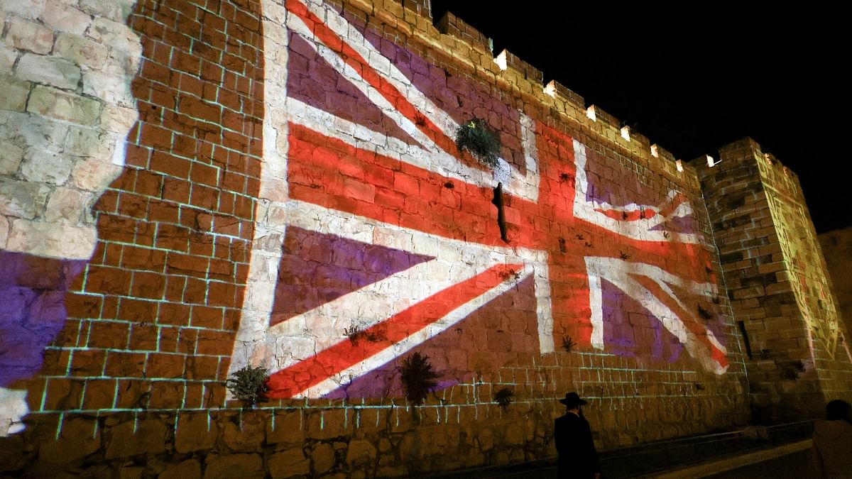 The walls of Jerusalem's Old City were illuminated with the Union Jack flag following the death of Queen Elizabeth II, Britain's longest-reigning monarch, in Jerusalem. Credit: Reuters Photo