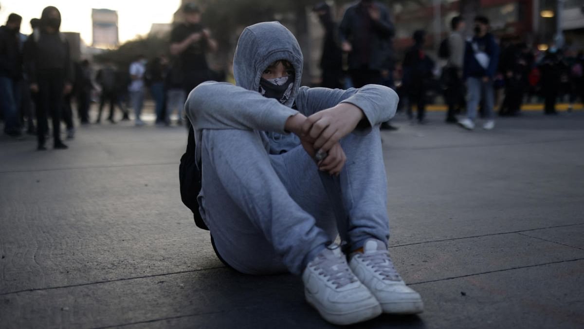 A demonstrator takes part in a protest demanding better conditions and improved infrastructure for studying, in Santiago, Chile September 9, 2022. Credit: Reuters Photo