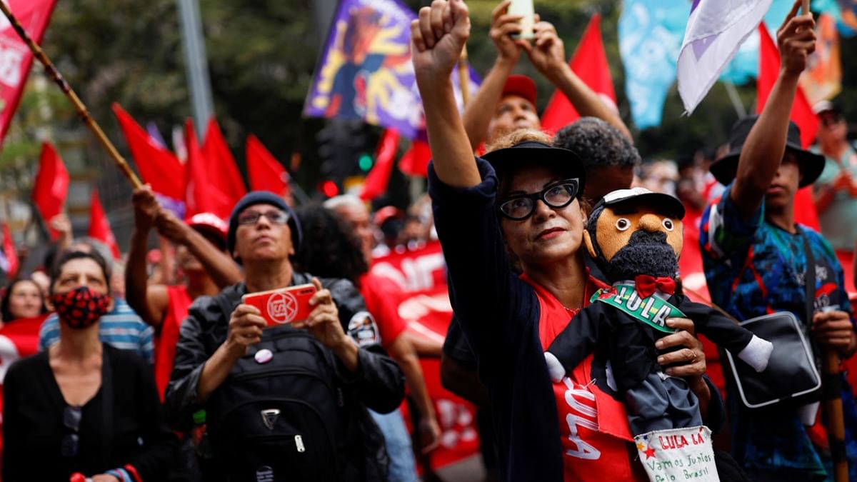 Eva Vieira, 65, holds a doll depicting former President of Brazil and presidential candidate Luiz Inacio Lula da Silva during a protest for democracy and against Brazil's President Jair Bolsonaro, in Sao Paulo, Brazil, September 10, 2022. Credit: Reuters Photo