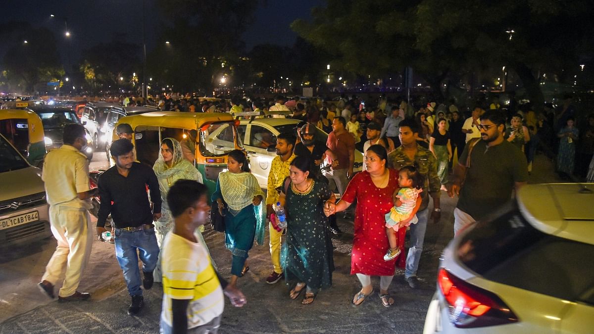 For many families, the iconic India Gate became their favourite weekend destination for resuming their pre-Covid-19 routines from spending some great time with the family at the newly-christened Kartavya Path. Credit: PTI Photo