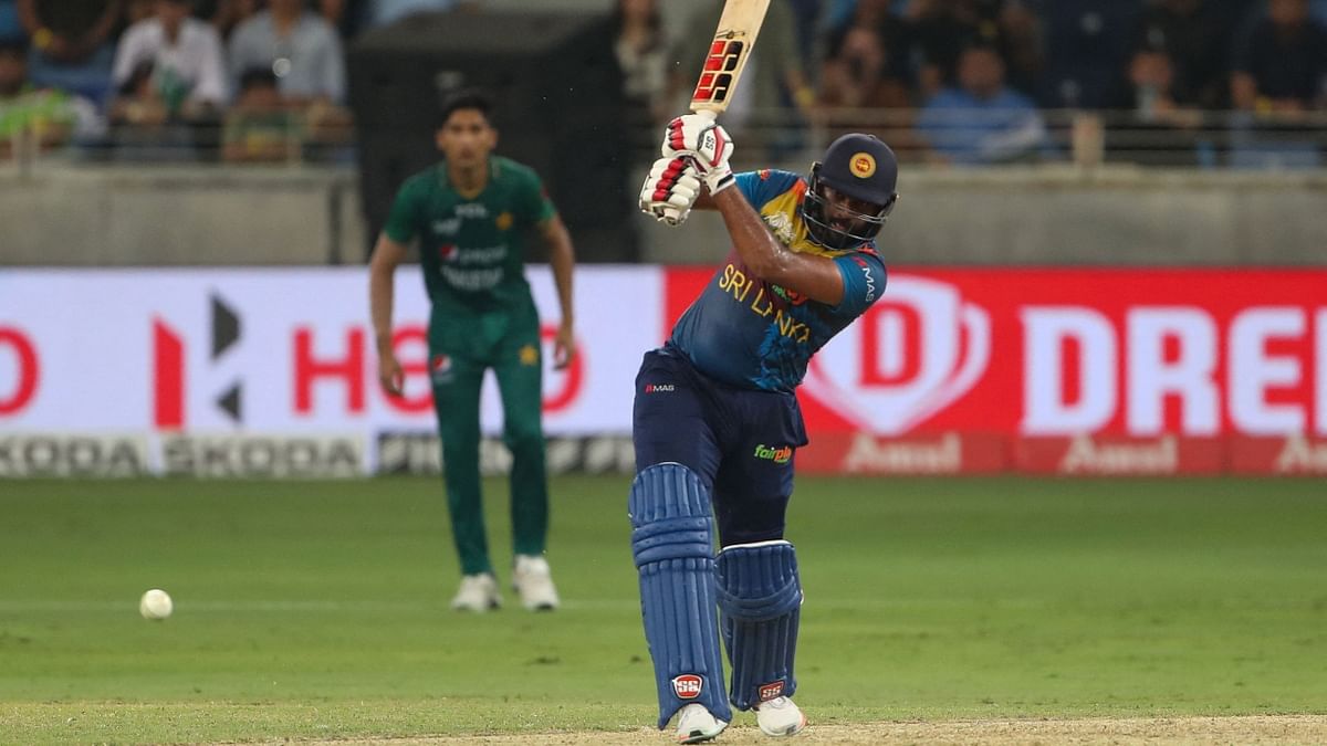 Rajapaksa kept up the attack and survived a dropped catch by Shadab Khan in the deep, soon reaching his third T20 half-century. Credit: AFP Photo