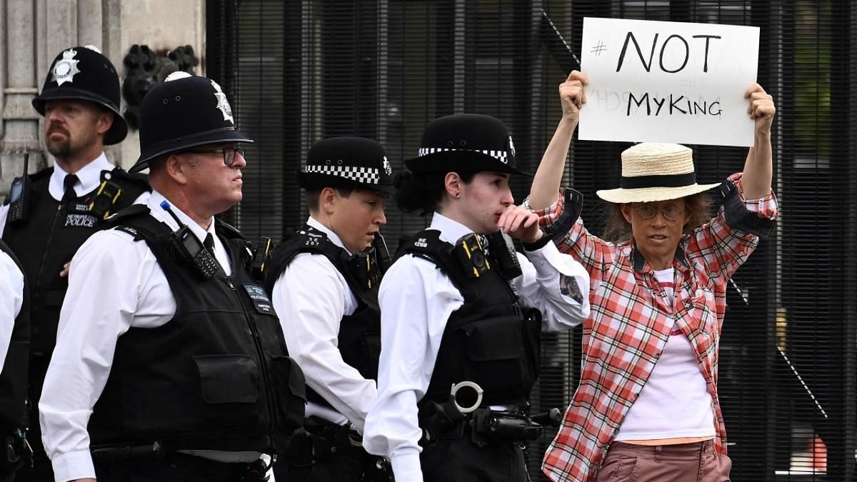 An anti-Royal demonstrator protests outside Palace of Westminster, central London on September 12, 2022, following the death of Queen Elizabeth II. Credit: AFP Photo