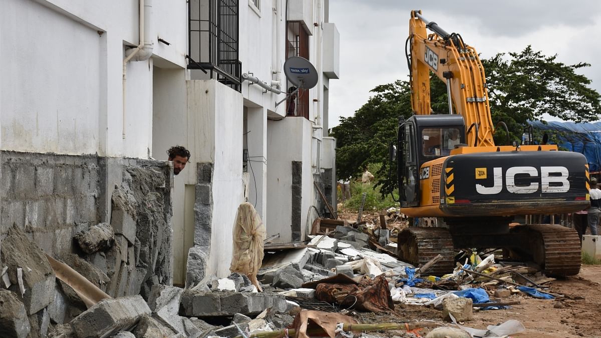 At Spice Garden Layout in Munnekolala, near Marathahalli, residents were tensed as BBMP demolished portions of compound walls, gates, or steps in front of the houses. Credit: B K Janardhan/ DH Photo