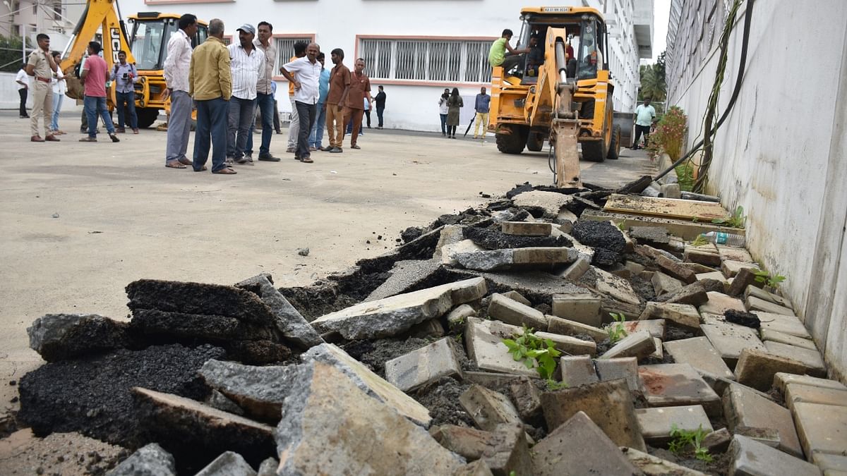 About 50 meters of encroachment have been cleared and the clearance operation is in process. Credit: B K Janardhan/ DH Photo