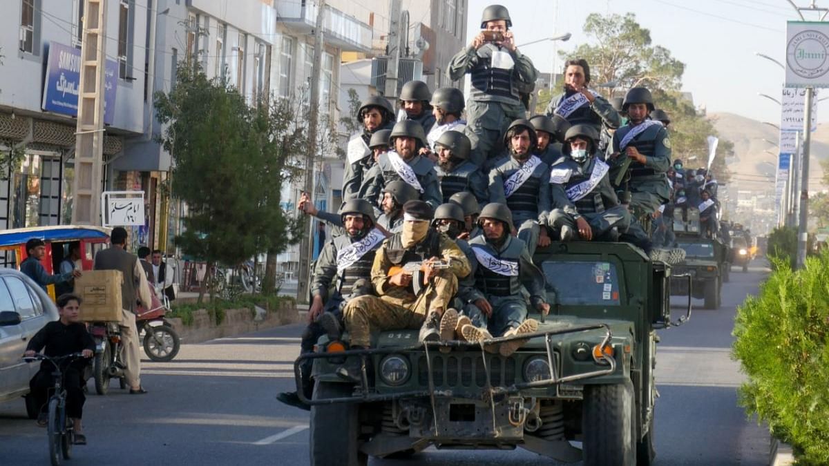 Newly recruited Taliban fighters parade in armoured vehicles after their graduation ceremony in Herat. Credit: AFP Photo