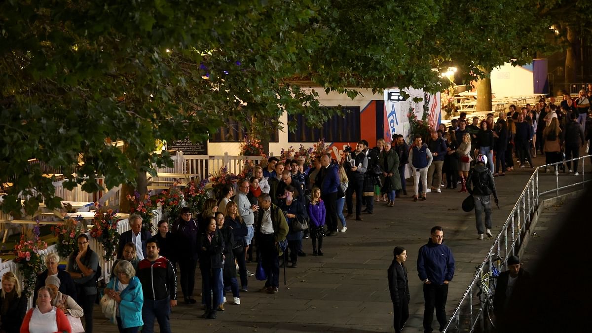 Within hours of the lying-in-state ceremony opening to the public at 5 pm local time on Wednesday evening, the queue was said to be over four-km-long winding around the river Thames. Credit: Reuters Photo