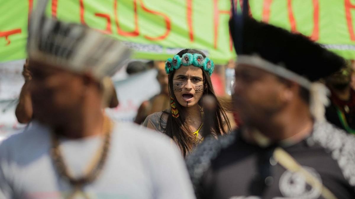 A Pataxo indigenous woman takes part in a demonstration against violence and for land demarcation in Brasilia. Credit: AFP Photo