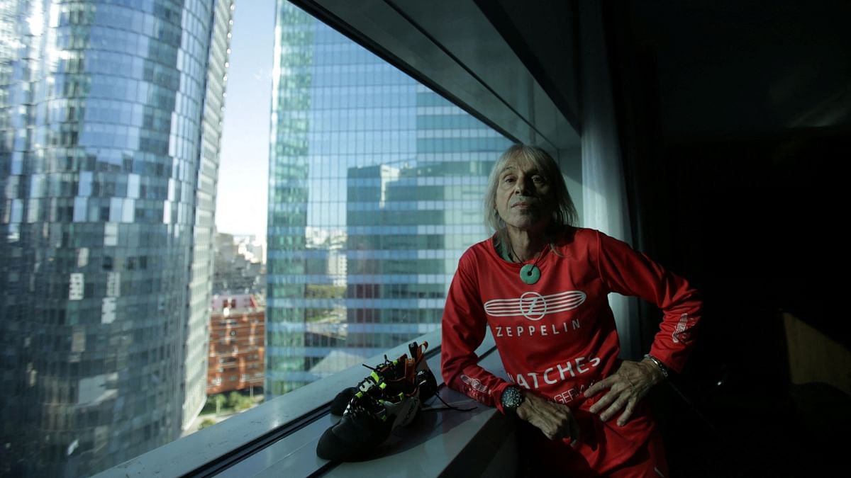 Alain Robert, the free climber dubbed the 'French Spiderman', scaled a 48-storey skyscraper in Paris, fulfilling a goal he had set for himself once he reached the age of 60. Credit: Reuters Photo