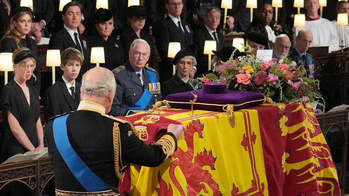 At the end of the final Hymn, King Charles III placed the Queen's Company Camp Colour of the Grenadier Guards on the coffin. Credit: AFP Photo