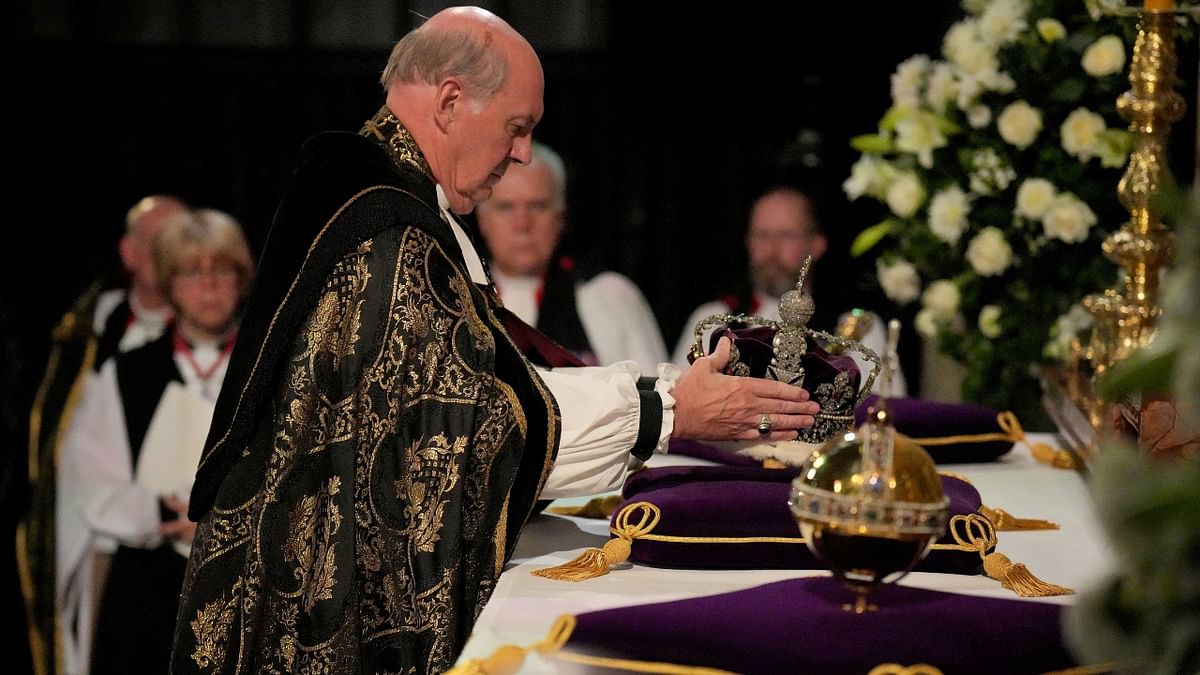 Prior to the final hymn, the Imperial State Crown, the orb and the sceptre – known as the Instruments of State – were removed from the coffin by the Crown Jeweller and, with the Bargemaster and Serjeants-at-Arms, passed to the Dean who placed them on the altar. Credit: Reuters Photo
