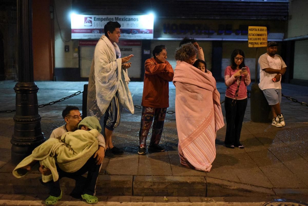 Residents stand in a street after a 6.8-magnitude earthquake in Mexico City. Credit: AFP Photo