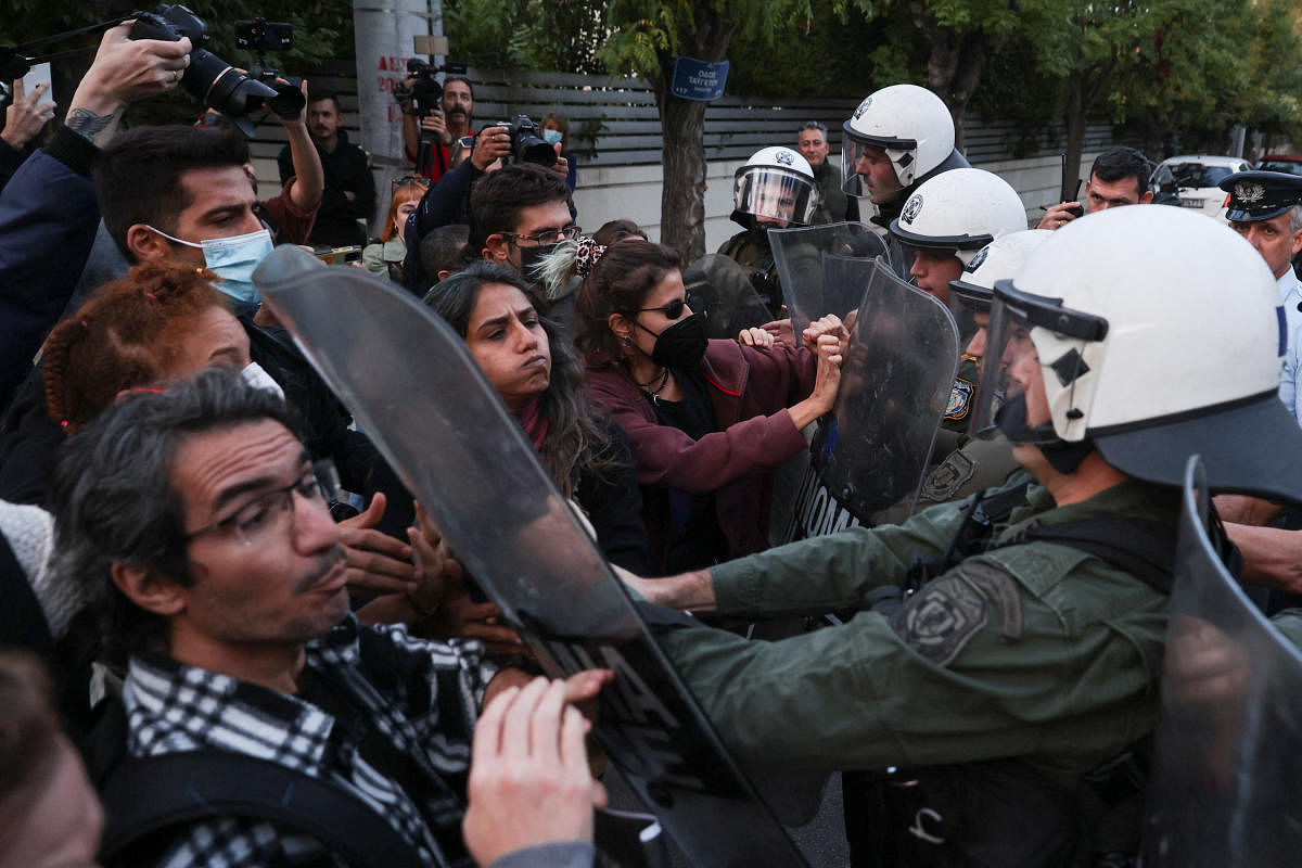 Demonstrators scuffle with riot police, during a protest following the death of Mahsa Amini, outside the Iranian Embassy, in Athens, Greece. Credit: Reuters Photo