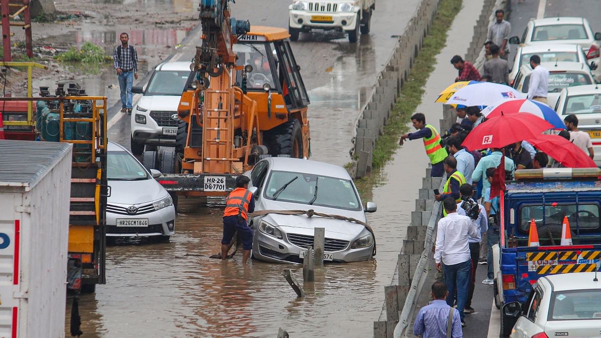 Despite the rain, vehicular movement was smooth in Gurugram. Traffic jams were reported in some areas in the morning due to waterlogging. Credit: PTI Photo