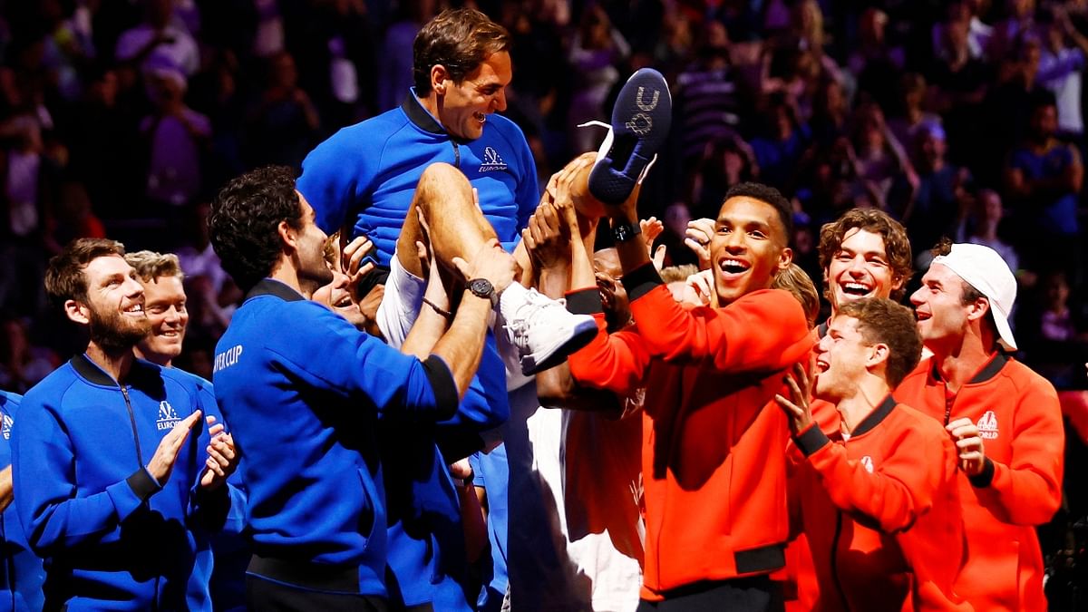 Team Europe and World members lift Roger Federer at the end of his last match. Credit: Reuters Photo