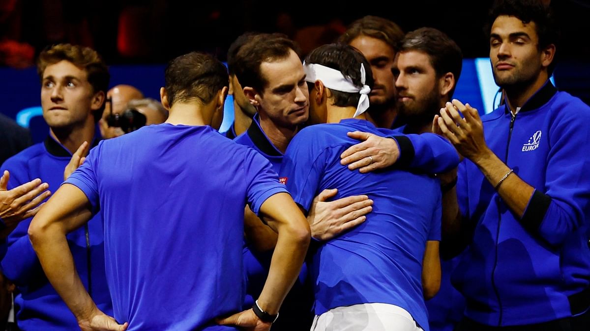 Rafael Nadal hugs Andy Murray as Roger Federer and others look on. Credit: Reuters Photo