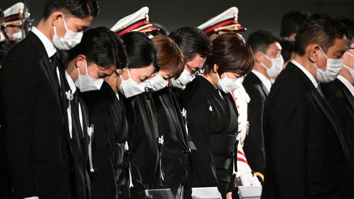 Within hours, about 10,000 people had laid flowers and bowed in silent prayer before Abe's picture, with many more waiting in long queues. Credit: AFP Photo