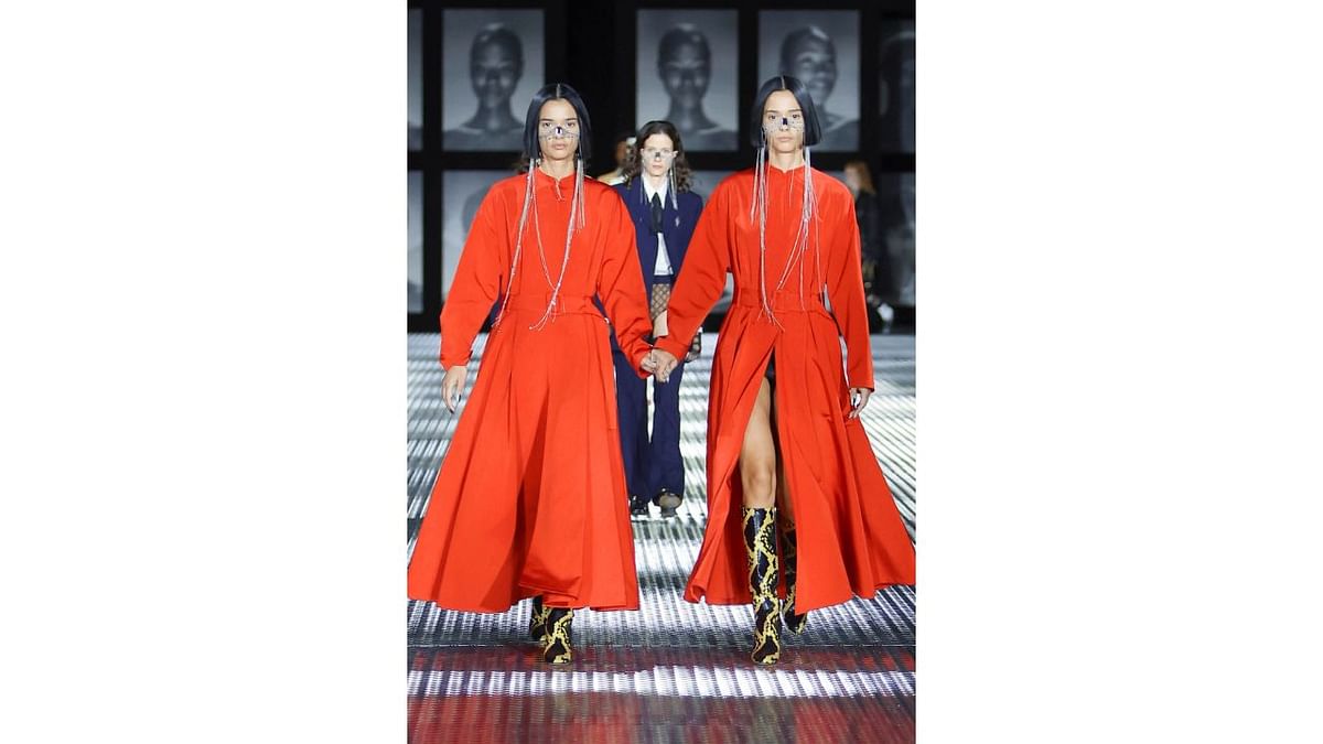 Models also wore floor-length trench coats, floral kimono-inspired designs, and ruffled silk dresses, among an eclectic mix of looks. Credit: Gucci/Facebook