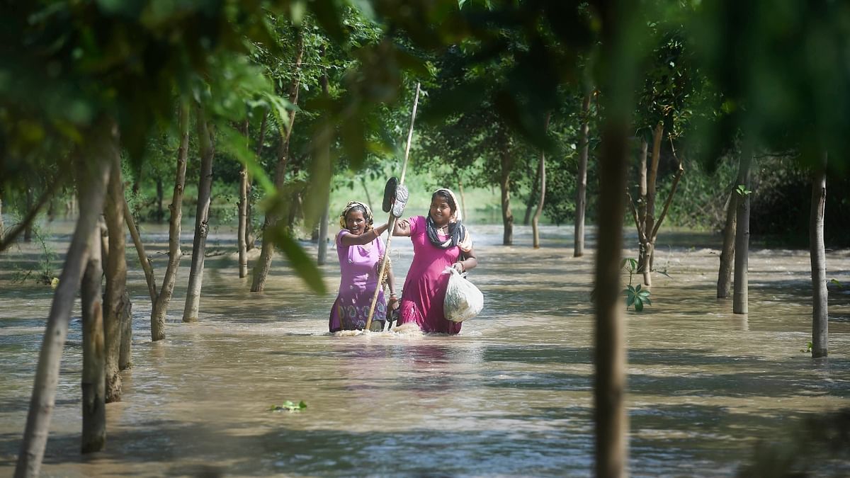 Authorities started evacuating people living in the low-lying areas near the Yamuna banks in Delhi with the water level in the river rising to 206.18 metres, much above the danger mark of 205.33 metres and the highest this year, following incessant rains. Credit: PTI Photo