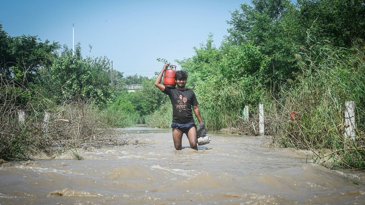 This is the second time within two months that the authorities are evacuating the people living in the river floodplains due to flooding. Credit: PTI Photo