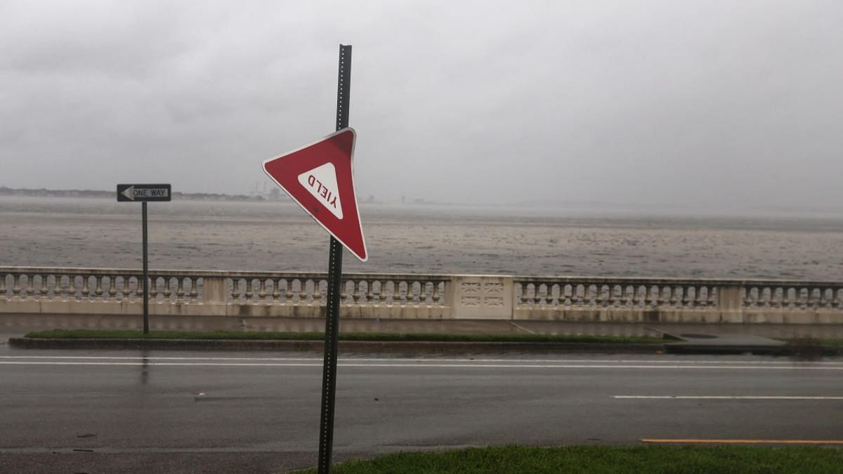 A street sign blows in the wind as Hurricane Ian makes landfall in southwestern Florida, in Tampa, Florid. Credit: Reuters photo