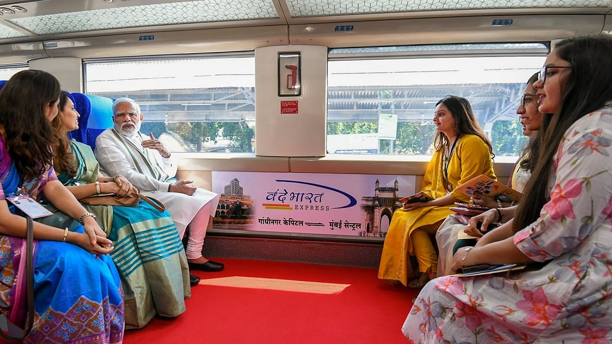 Prime Minister Narendra Modi rides the Gandhinagar-Mumbai Vande Bharat Express train after flagging it off, in Gandhinagar. Credit: PTI Photo