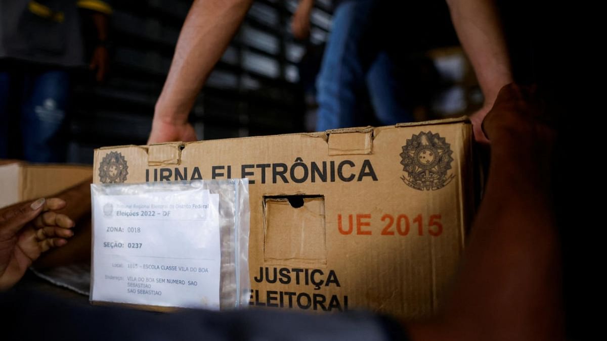 Employees load a truck with the electronic voting machines that will be used to vote in the first round of the upcoming Brazilian presidential elections, in Brasilia. Credit: Reuters photo